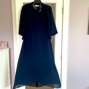Danny Nicole size 10, Navy Blue. Dress has longer hemline in back then front.